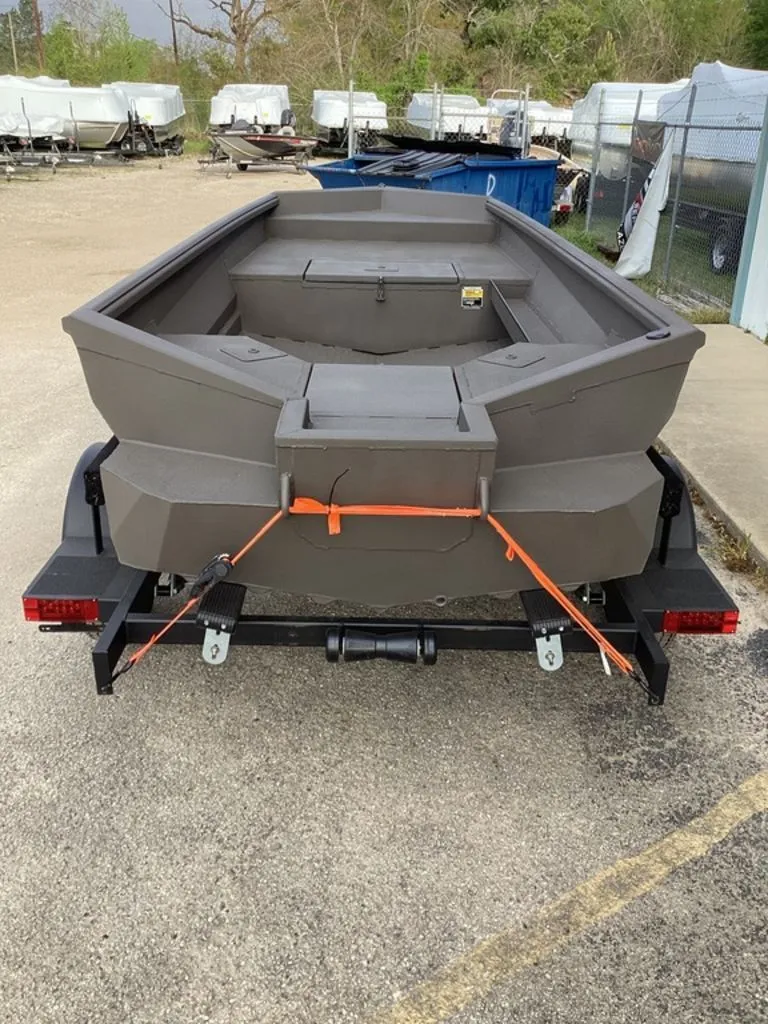 Slide: The Image of Reaper 656 boat on trailer, year 2026, in a storage lot. - 2