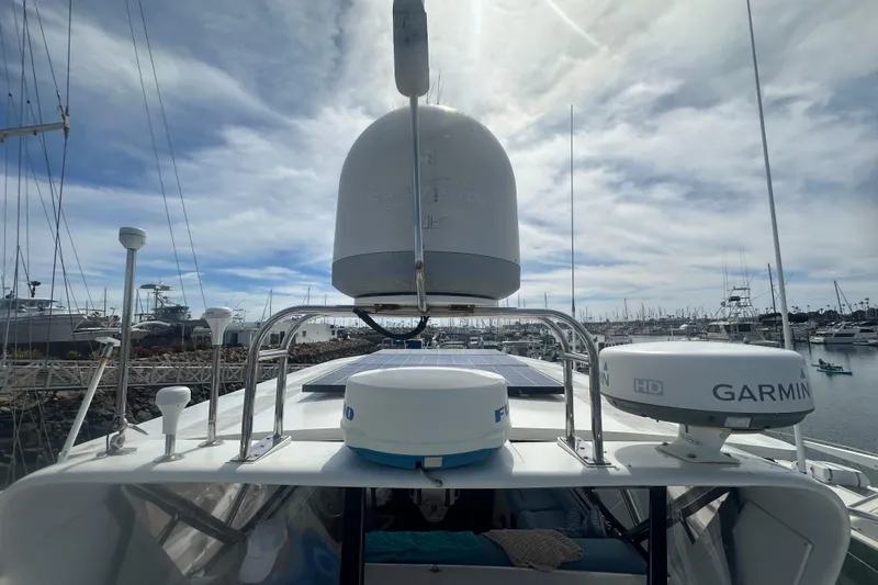 Slide: The Image of 1991 Californian 52 Cockpit Motor Yacht with navigation equipment, docked in a marina. - 22