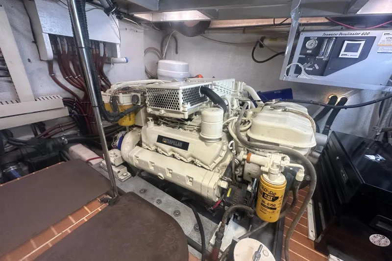 Slide: The Image of Engine room of 1991 Californian 52 Cockpit Motor Yacht with Caterpillar engine and seawater desalinator. - 24