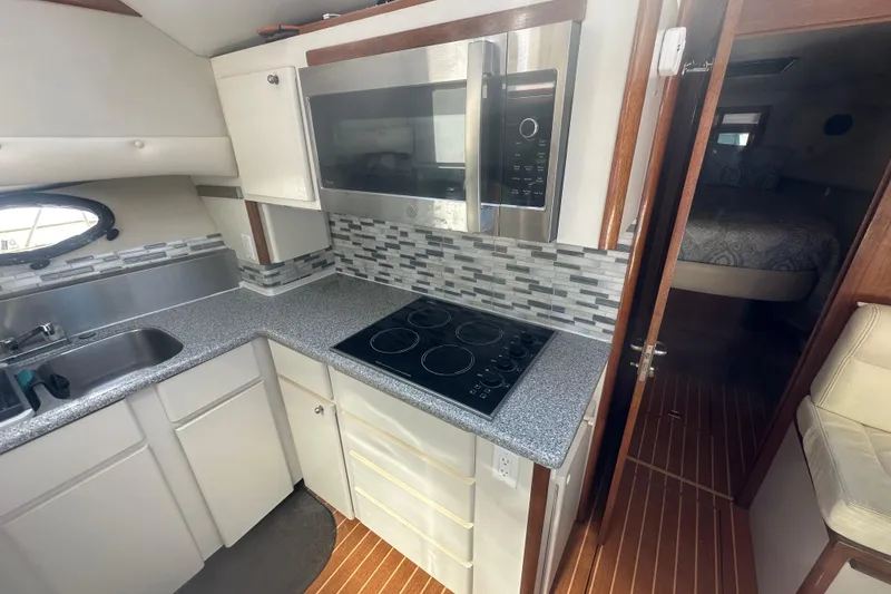Slide: The Image of 1991 Californian 52 Cockpit Motor Yacht kitchen with modern appliances and sleek design. - 3