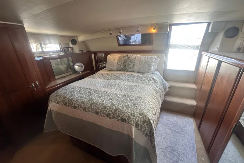Slide: The Image of Luxurious bedroom interior of 1991 Californian 52 Cockpit Motor Yacht with elegant bedding. - 7