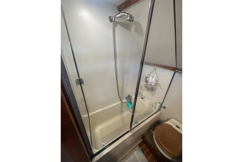 Slide: The Image of Shower and toilet area in 1991 Californian 52 Cockpit Motor Yacht bathroom. - 9