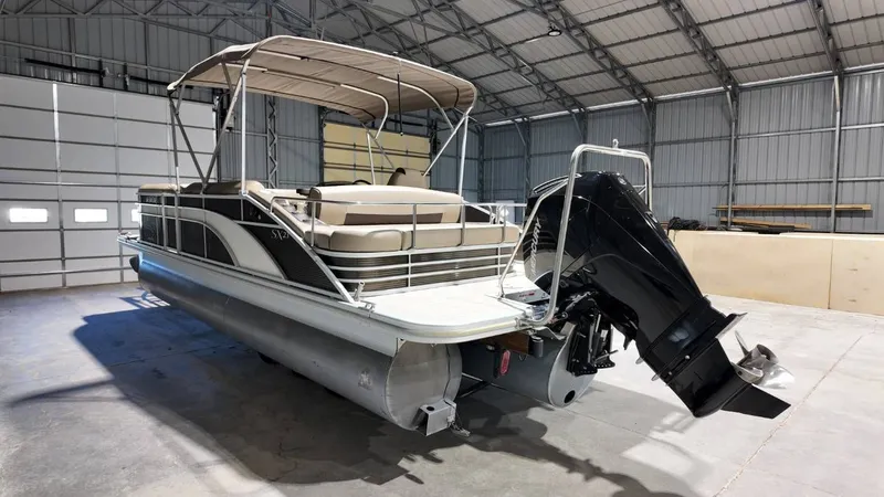 Slide: The Image of 2019 Bennington SXP SERIES 23SS pontoon boat in storage facility. - 15