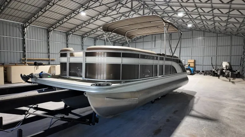 Slide: The Image of 2019 Bennington SXP SERIES 23SS pontoon boat in storage facility. - 17