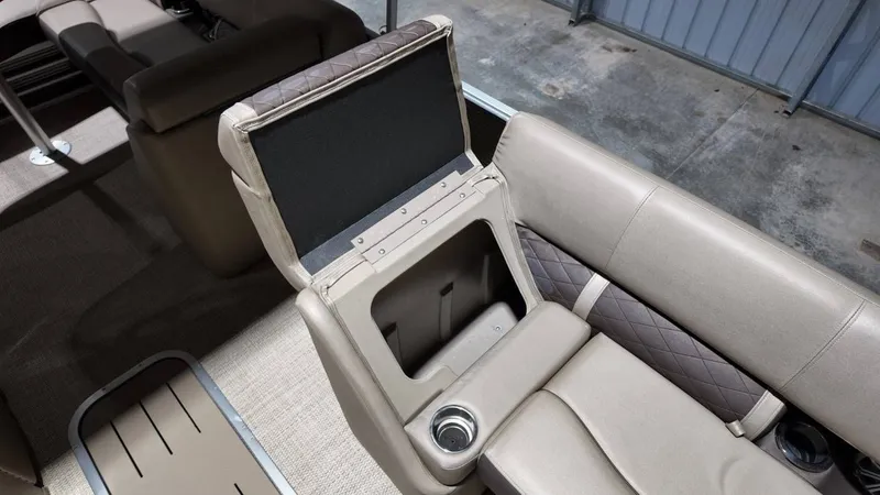 Slide: The Image of Interior of 2019 Bennington SXP SERIES 23SS with storage compartment. - 33