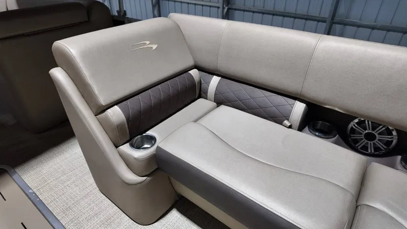 Slide: The Image of Interior of a 2019 Bennington SXP SERIES 23SS boat with beige upholstery. - 34
