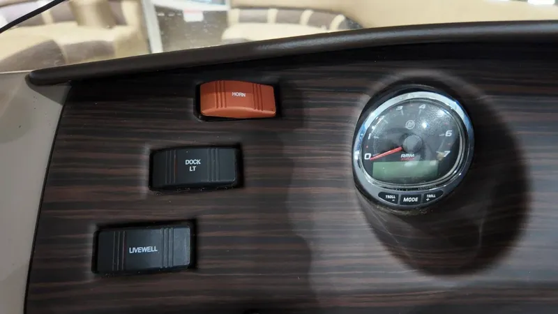 Slide: The Image of Dashboard of 2019 Bennington SXP SERIES 23SS with switches and tachometer. - 42