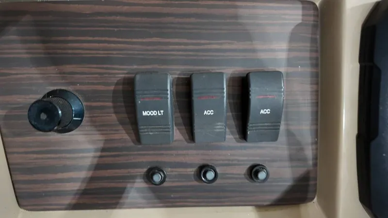 Slide: The Image of Control panel of 2019 Bennington SXP SERIES 23SS with switches and knob. - 45