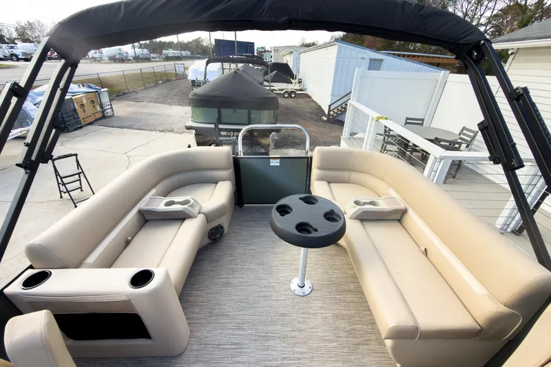 Slide: The Image of 2026 Godfrey Sweetwater Xperience 22' Split Bench Pontoon with beige seating and cup holders. - 20