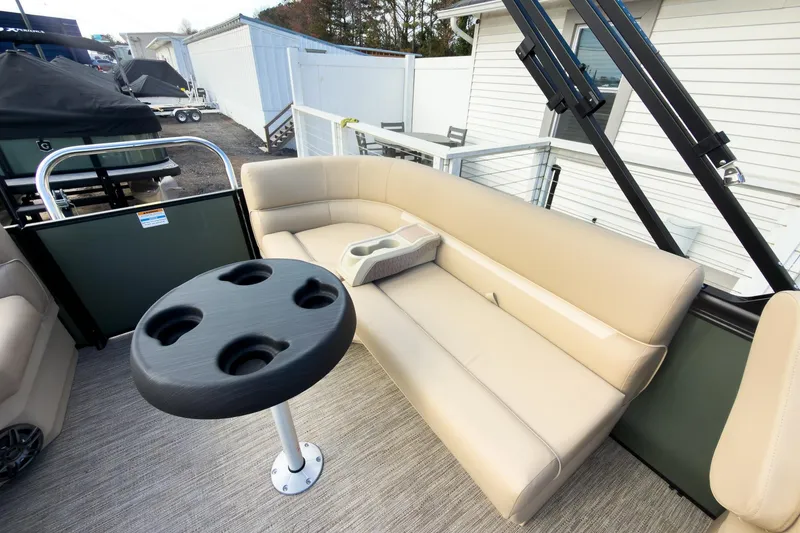Slide: The Image of 2026 Godfrey Sweetwater Xperience 22' pontoon with split bench seating and cup holder table. - 23