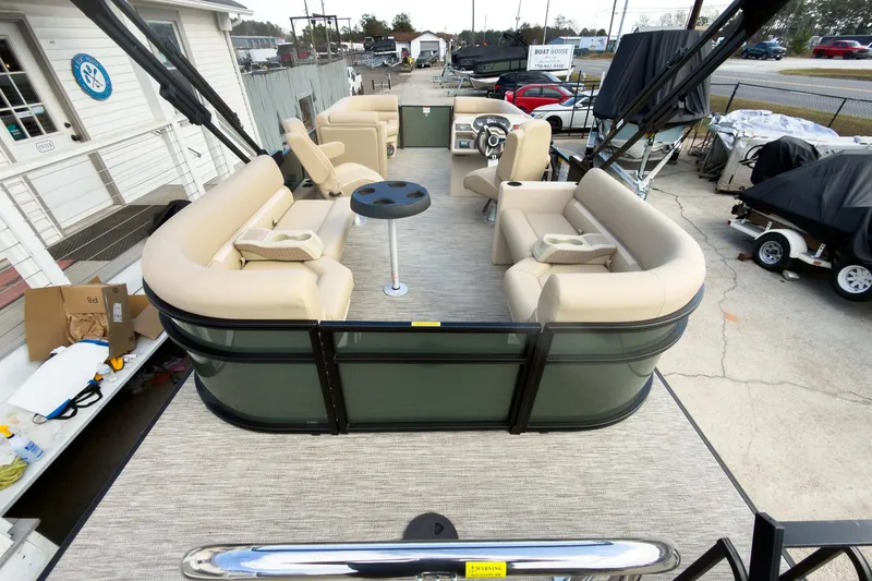 Slide: The Image of 2026 Godfrey Sweetwater Xperience 22' Split Bench Pontoon with beige seating and modern design. - 27
