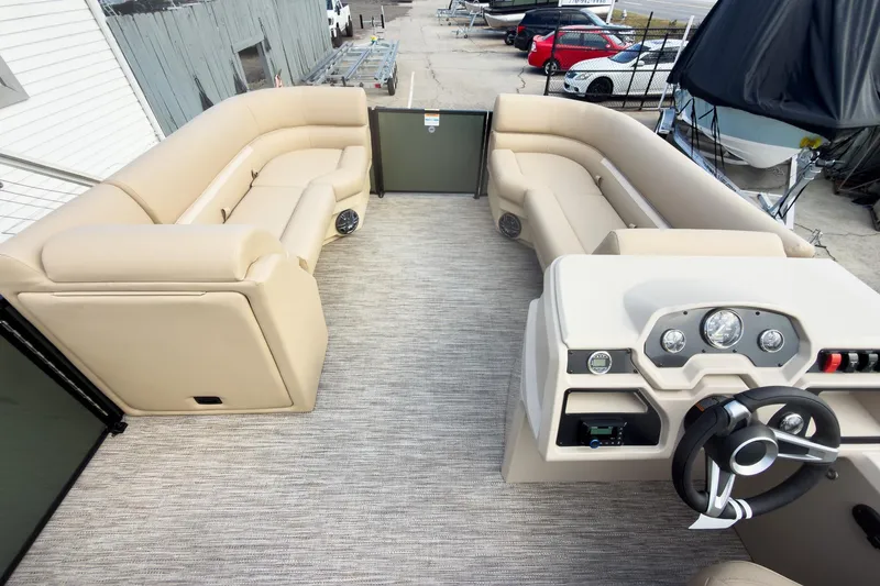 Slide: The Image of 2026 Godfrey Sweetwater Xperience 22' Split Bench Pontoon with beige seating and modern dashboard. - 30