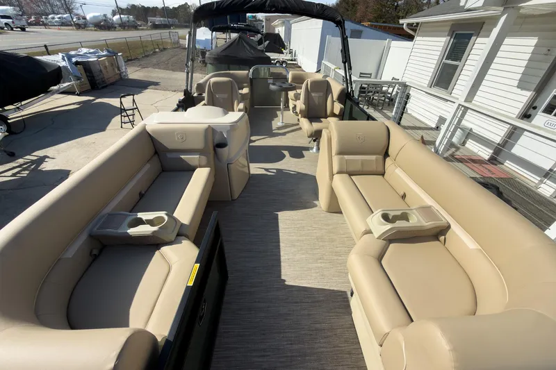 Slide: The Image of 2026 Godfrey Sweetwater Xperience 22' Split Bench Pontoon with beige seating and spacious layout. - 10