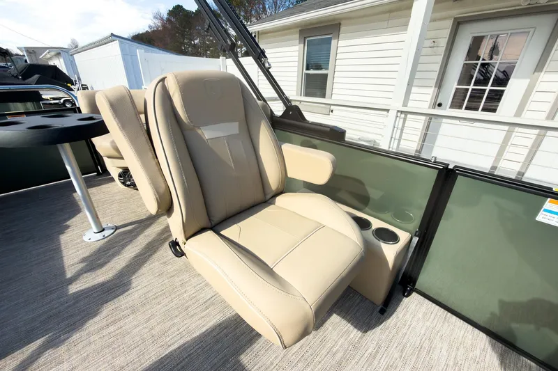 Slide: The Image of 2026 Godfrey Sweetwater Xperience 22' Split Bench Pontoon with beige seating and cup holders. - 18