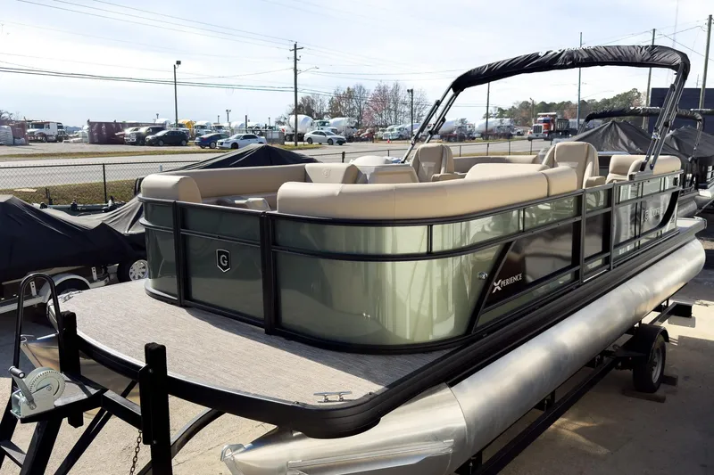 The Image of 2026 Godfrey Sweetwater Xperience 22' Split Bench Pontoon on trailer, outdoor display. - 2