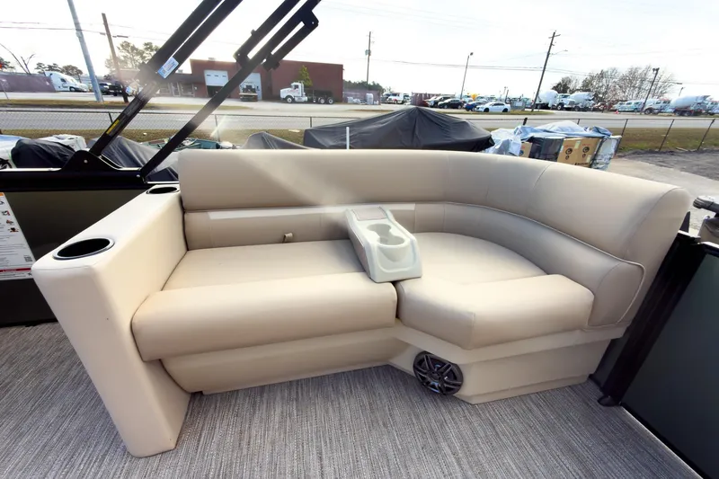 Slide: The Image of 2026 Godfrey Sweetwater Xperience 22' Split Bench Pontoon with beige seating and cup holders. - 22