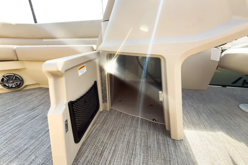 Slide: The Image of 2026 Godfrey Sweetwater Xperience 22' Pontoon interior storage compartment with sunlight reflection. - 31