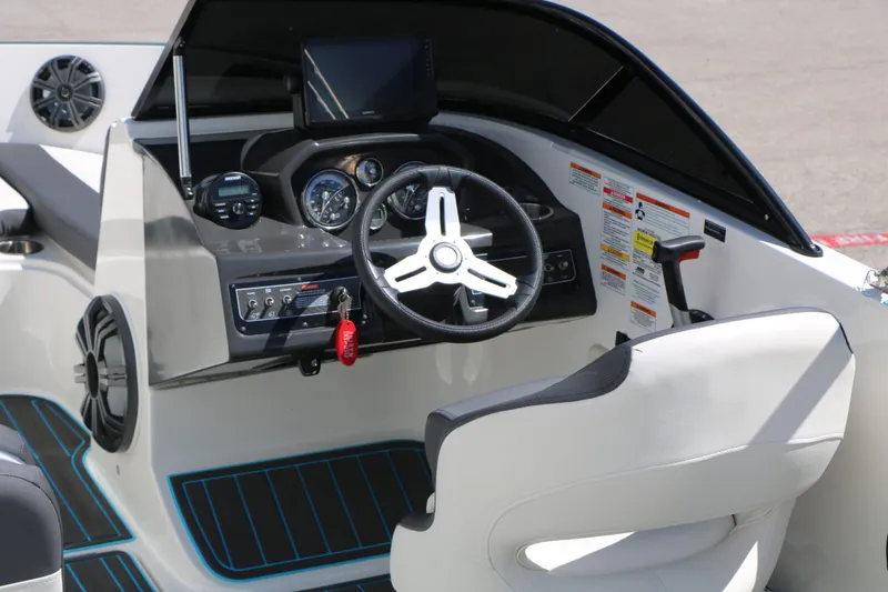 Slide: The Image of Interior view of 2022 Bayliner VR5 helm station. - 15