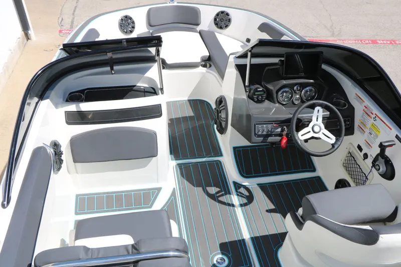 Slide: The Image of Interior of a 2022 Bayliner VR5 boat with modern cockpit. - 17