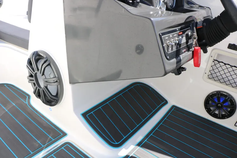 Slide: The Image of Interior of 2022 Bayliner VR5 with speakers and control console. - 26