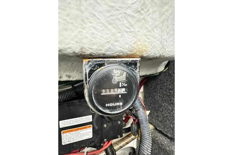 Slide: The Image of Hour meter on a 2008 Yamaha Boats 212X, displaying 126 hours. - 16