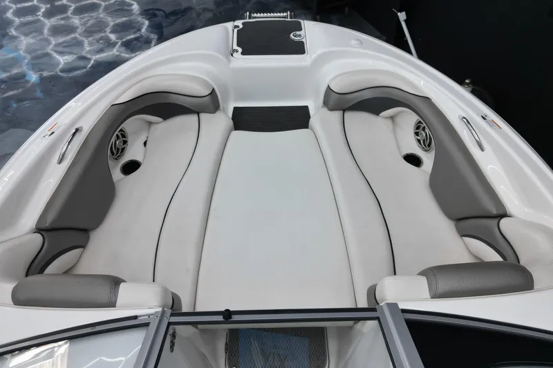 Slide: The Image of 2008 Yamaha Boats 212X interior with white and gray seating, showcasing spacious bow area. - 4