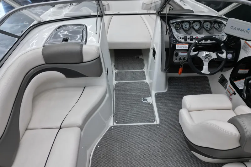 Slide: The Image of 2008 Yamaha Boats 212X interior with steering wheel, seating, and dashboard controls. - 6