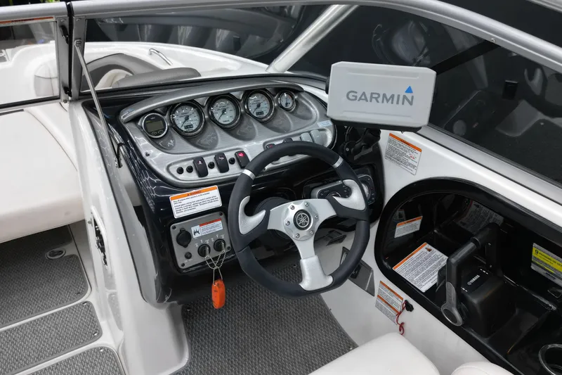 Slide: The Image of 2008 Yamaha Boats 212X dashboard with Garmin navigation system and steering wheel. - 7