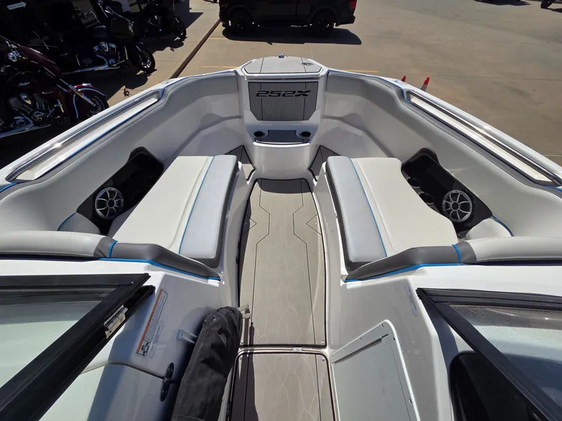 Slide: The Image of Interior of 2021 Yamaha Boats 252XE with seating and speakers. - 13