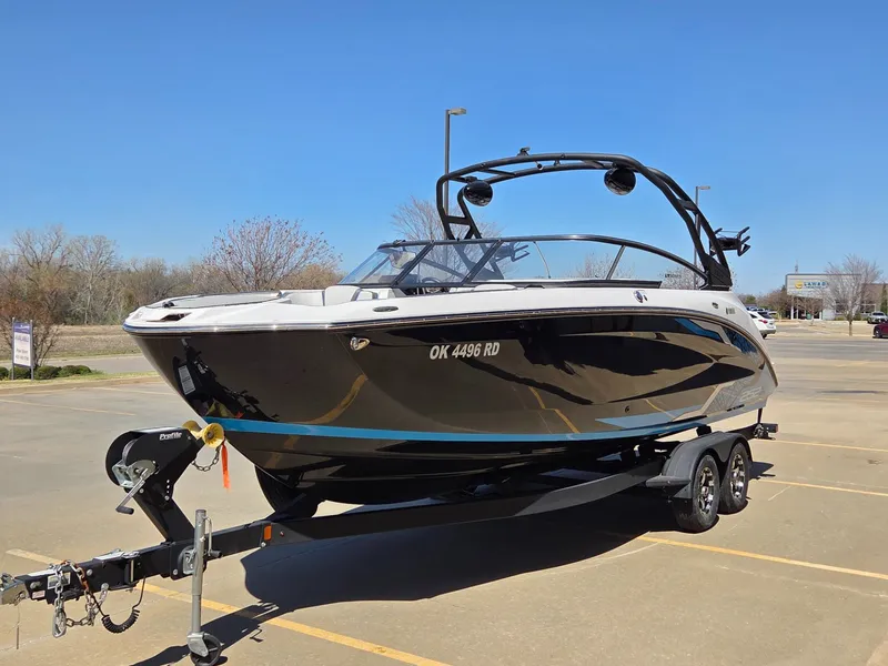 Slide: The Image of 2021 Yamaha Boats 252XE parked outdoors on a trailer. - 4