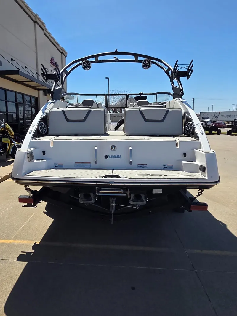 Slide: The Image of Rear view of a 2021 Yamaha Boats 252XE on a parking lot. - 7