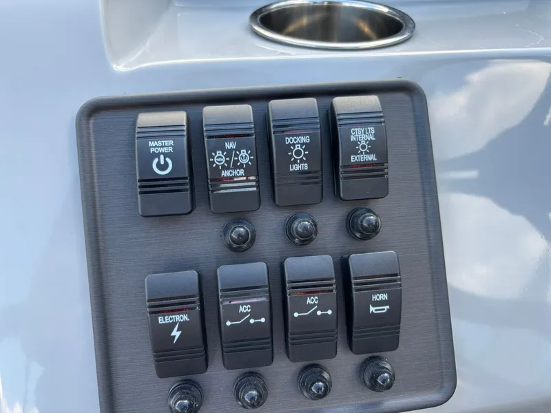 Slide: The Image of Control panel of 2026 Bentley Pontoons 223 Bolt with various switches. - 18
