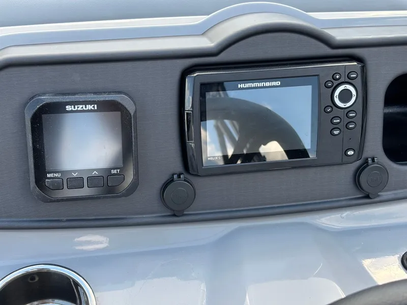 Slide: The Image of 2026 Bentley Pontoons 223 Bolt dashboard with Suzuki and Humminbird displays. - 19