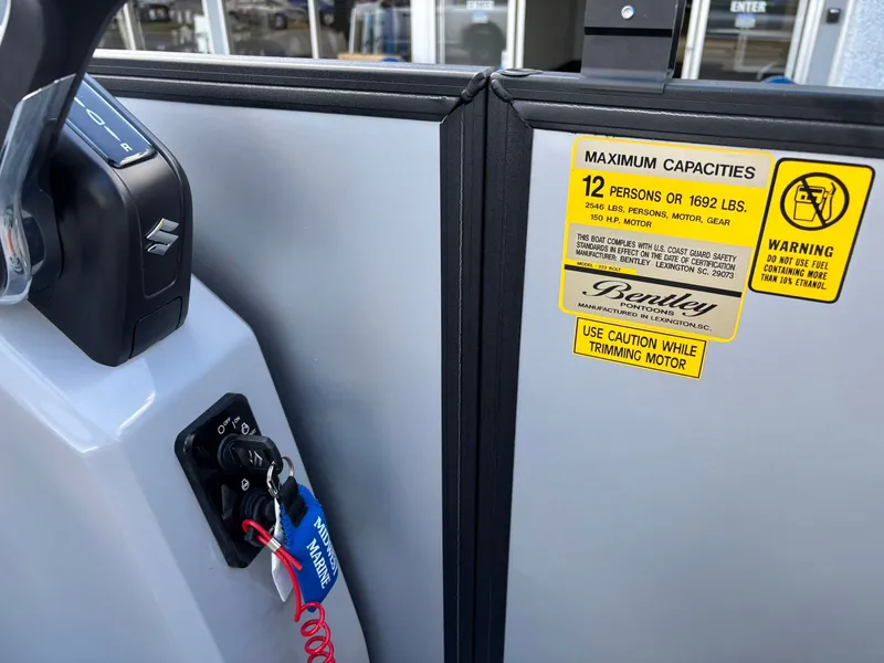 Slide: The Image of Bentley Pontoons 223 Bolt 2026, capacity for 12 people, safety warnings visible. - 21