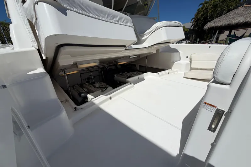 Slide: The Image of 2005 Tiara Yachts 3600 Sovran engine compartment, open hatch, white interior, sunny day. - 13