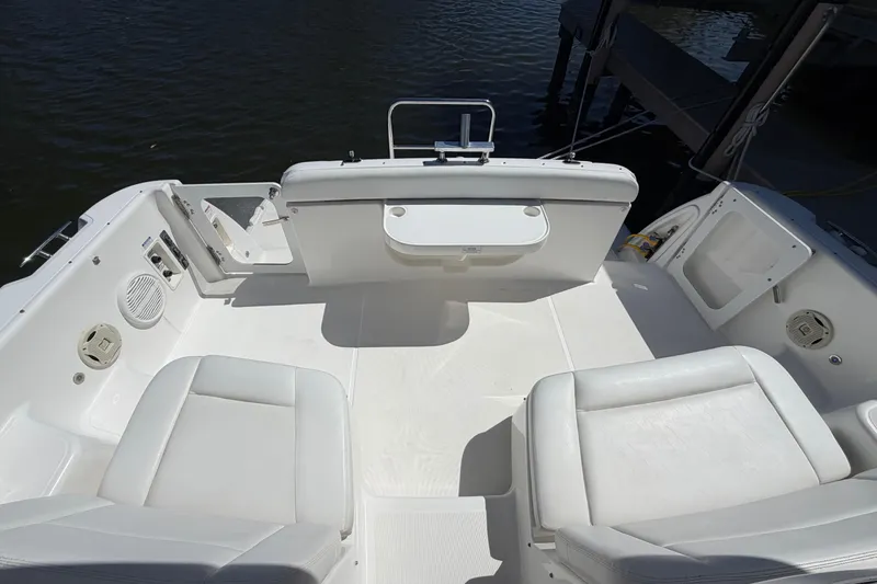 Slide: The Image of 2005 Tiara Yachts 3600 Sovran cockpit with white seating and water view. - 14