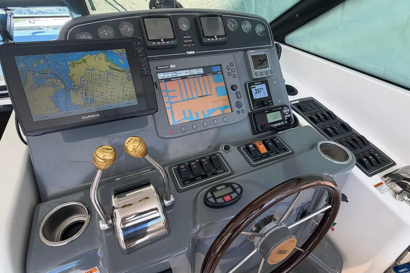 Slide: The Image of Cockpit of 2005 Tiara Yachts 3600 Sovran with navigation and control systems. - 17