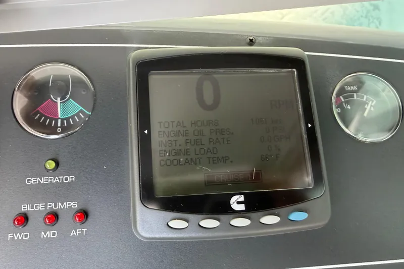 Slide: The Image of Dashboard of a 2005 Tiara Yachts 3600 Sovran showing gauges and digital display. - 18