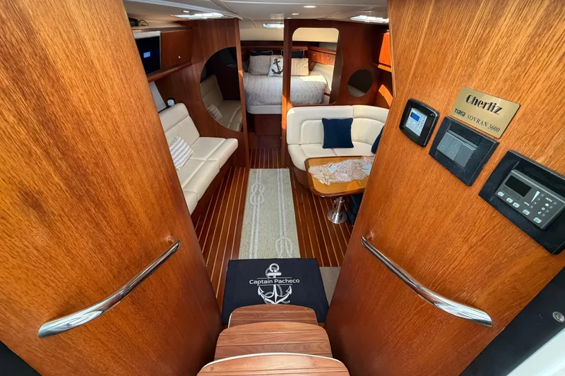Slide: The Image of Luxurious interior of 2005 Tiara Yachts 3600 Sovran with wood finish and cozy seating. - 19