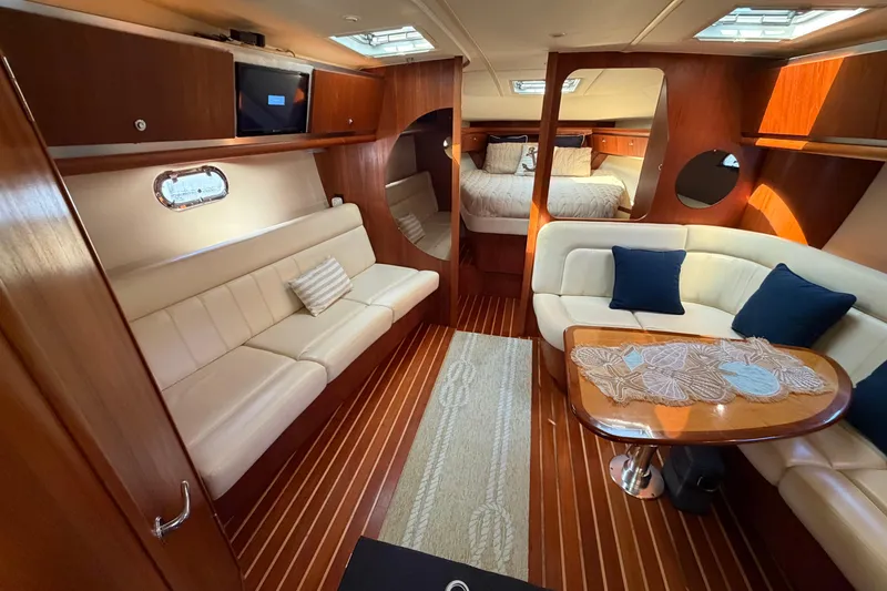 Slide: The Image of Luxurious interior of a 2005 Tiara Yachts 3600 Sovran, featuring elegant seating and wood finishes. - 20