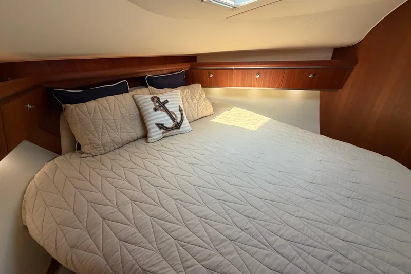Slide: The Image of Luxurious cabin interior of 2005 Tiara Yachts 3600 Sovran with nautical-themed bedding. - 28