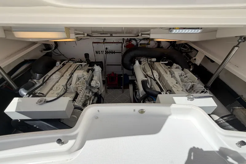 Slide: The Image of Engine compartment of a 2005 Tiara Yachts 3600 Sovran, showcasing dual engines. - 39