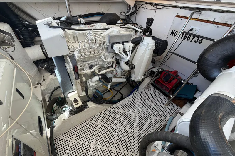 Slide: The Image of Engine room of a 2005 Tiara Yachts 3600 Sovran, showcasing mechanical components and equipment. - 42