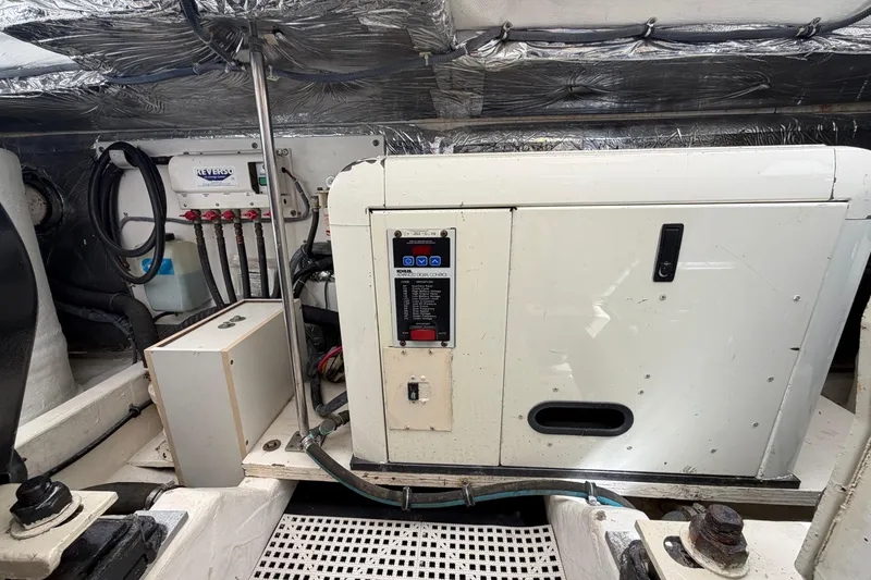 Slide: The Image of Engine room of a 2005 Tiara Yachts 3600 Sovran, featuring mechanical equipment. - 43