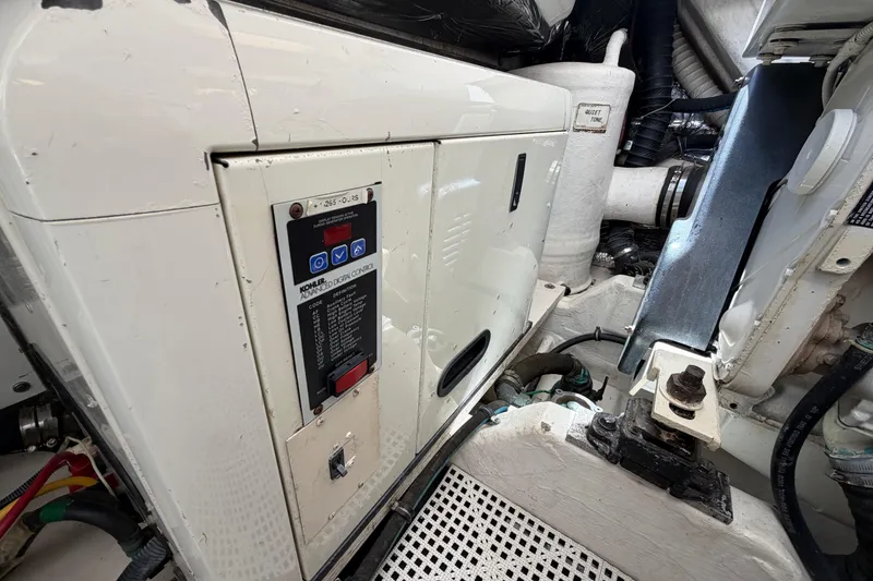 Slide: The Image of Engine room of 2005 Tiara Yachts 3600 Sovran, featuring Kohler generator control panel. - 44
