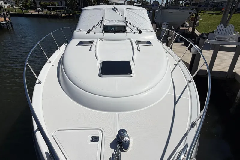 Slide: The Image of 2005 Tiara Yachts 3600 Sovran docked, showcasing sleek deck design and modern features. - 6