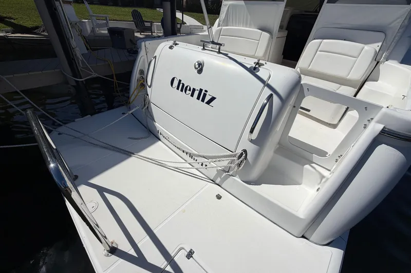 Slide: The Image of 2005 Tiara Yachts 3600 Sovran boat docked, featuring spacious seating and sleek design. - 9