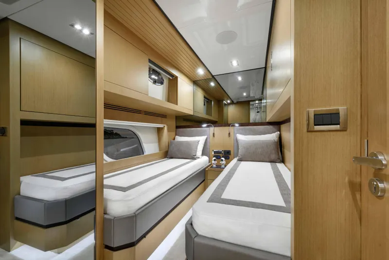 Slide: The Image of Luxurious twin cabin interior of 2025 Vicem 65 Classic yacht, featuring modern wood finishes. - 12