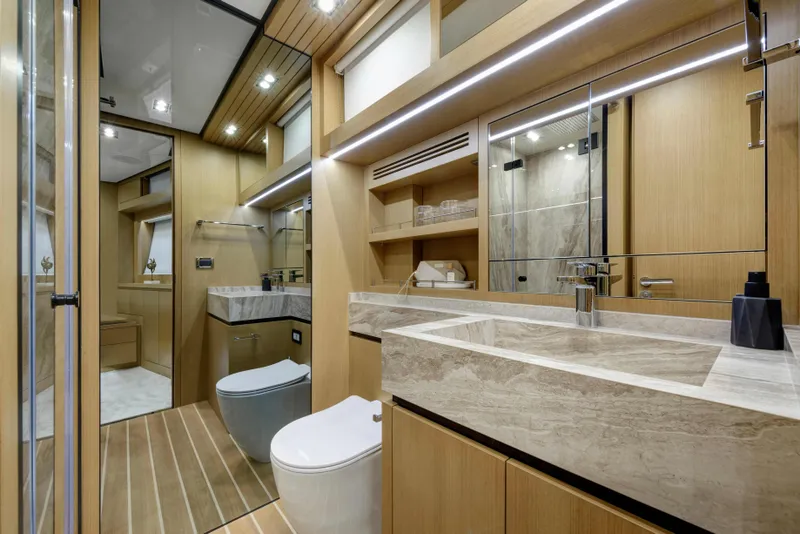 Slide: The Image of Luxurious bathroom interior of 2025 Vicem 65 Classic yacht with modern fixtures and wood accents. - 13