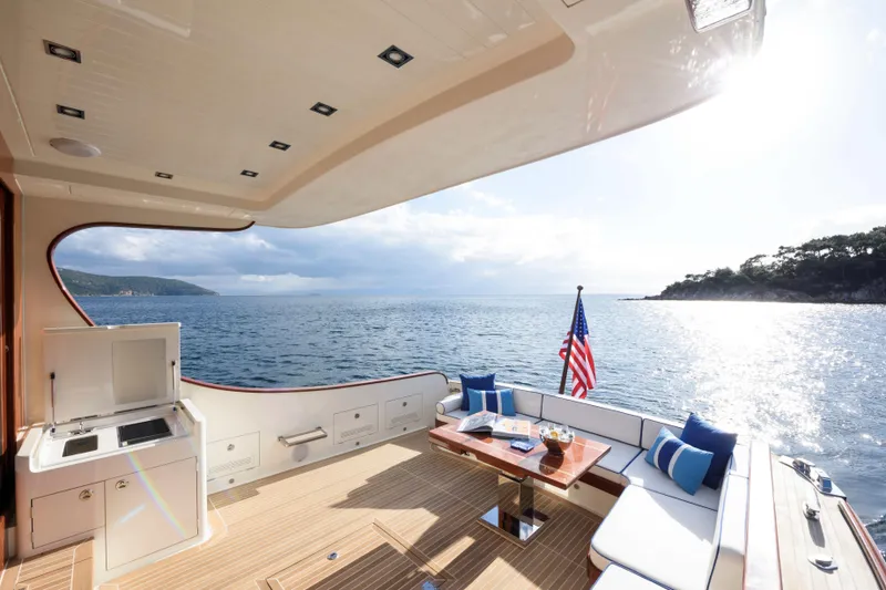 Slide: The Image of Luxurious 2025 Vicem 65 Classic yacht deck with ocean view and elegant seating area. - 3